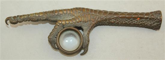 A Continental bronze loupe or magnifying glass, modelled as an eagles claw, 5.75in.